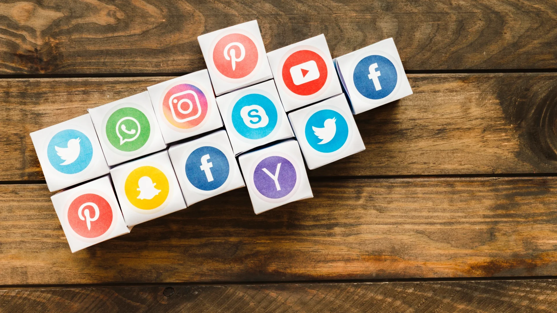 arrow-made-with-boxes-vivid-social-media-icons-wooden-plank